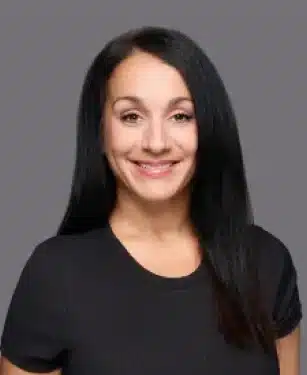 Elizabeth the office manager at Aurora Dental Group smiling in a professional headshot