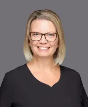 Julie the registered dental hygienist at Aurora Dental Group smiling in a professional headshot