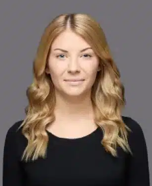 Kendal the dental administrator at Aurora Dental Group smiling in a professional headshot