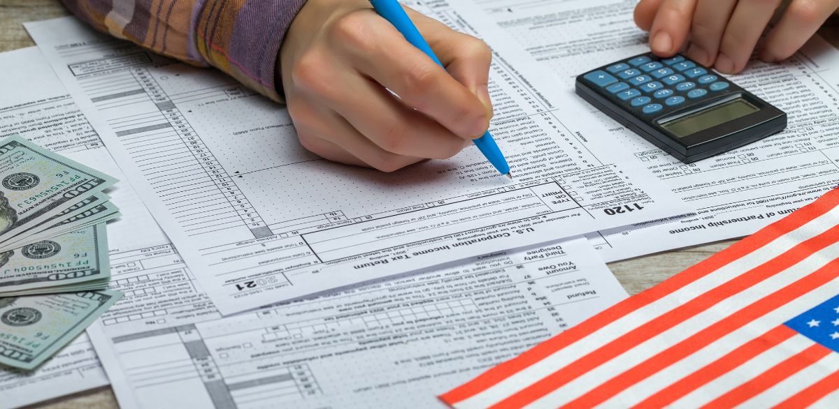 Person reviewing financial documents to optimize dental insurance benefits