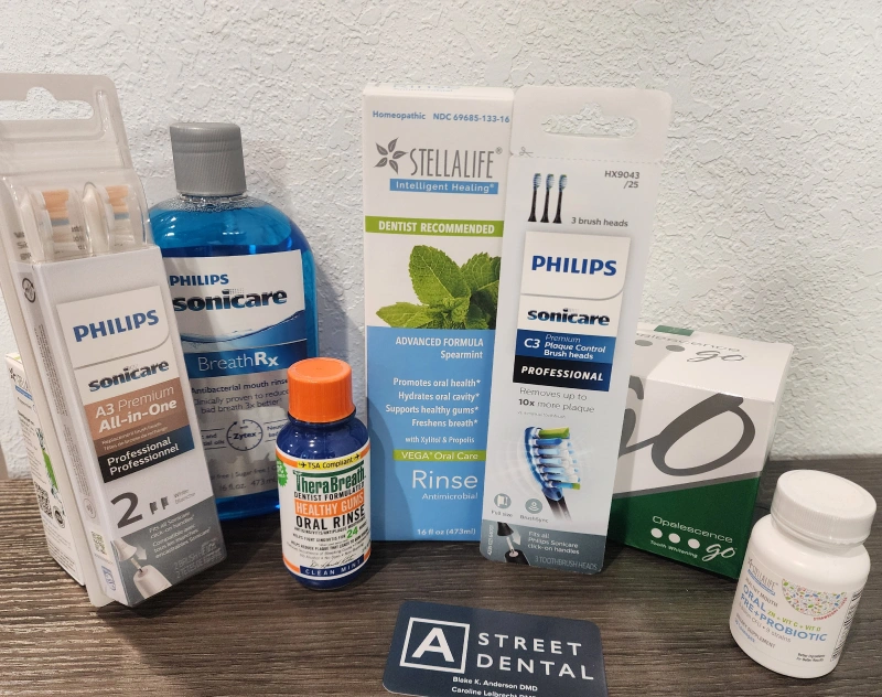 Dental care products displayed including Philips Sonicare toothbrushes, rinse, and professional supplies.
