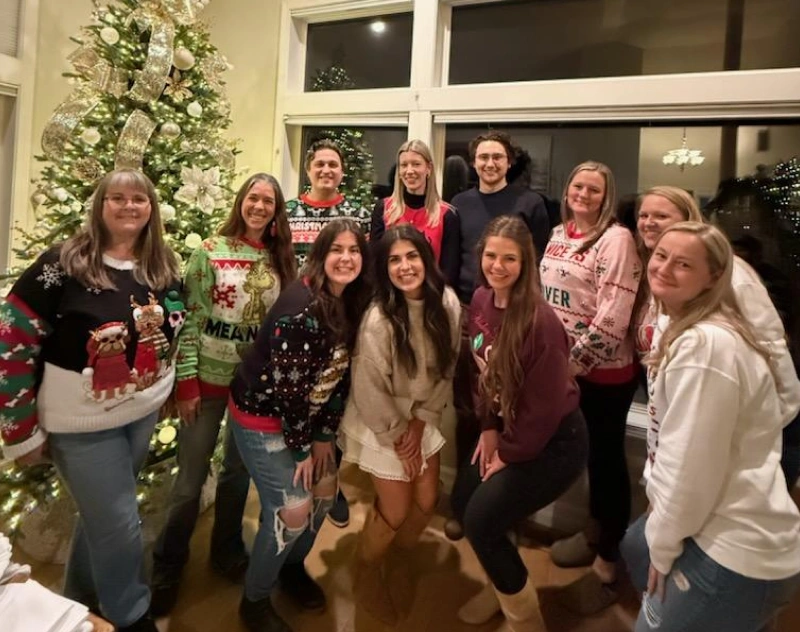 Dental team celebrating the holidays together in festive sweaters at Grants Pass office.