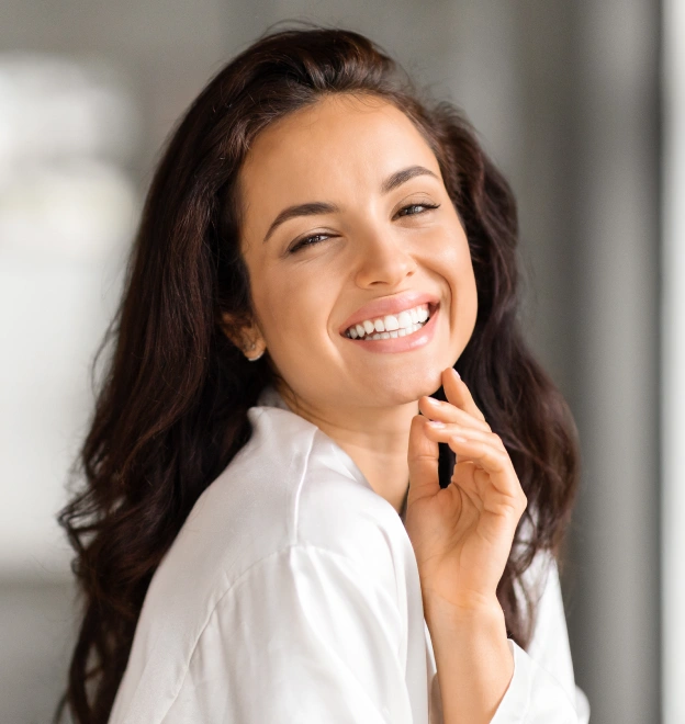 Smiling woman with healthy teeth after fluoride treatment in Grants Pass.
