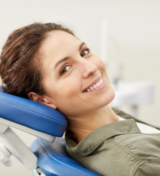 Smiling patient relaxing in dental chair during sedation dentistry treatment in Grants Pass.
