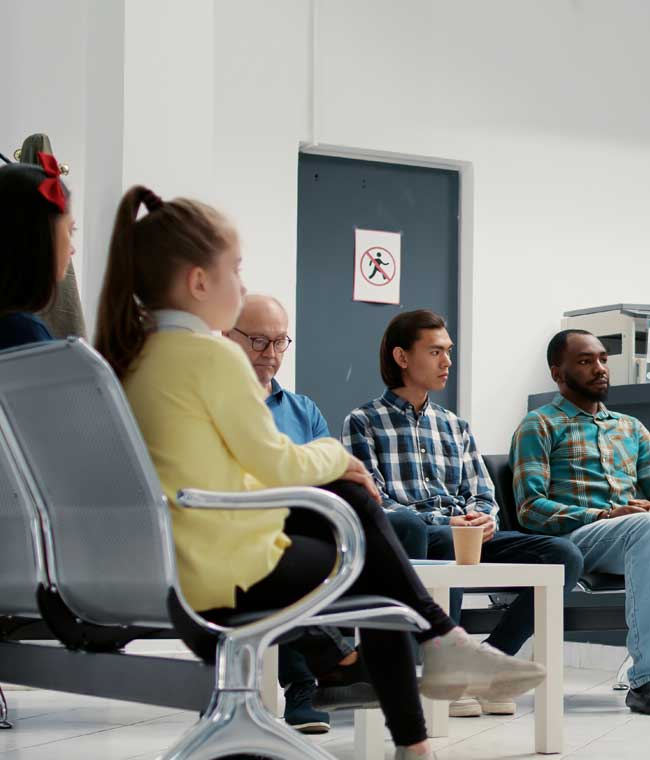 Patients waiting in a modern dental office reception area at a practice in Newnan, GA.