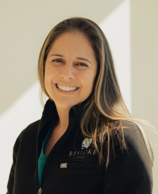 Dr. Rask smiling in professional attire at Newnan dental practice.