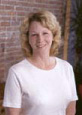 Vivian, a dental professional at the Newnan, GA practice, smiles warmly at the camera.