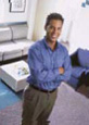 William, a dentist at the Newnan dental practice, smiles in his office.