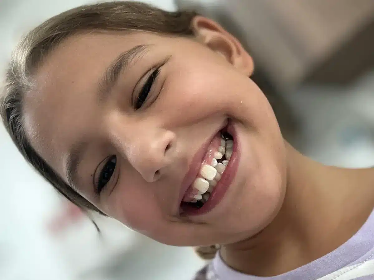 Happy child smiling after visit to Plantation dentist