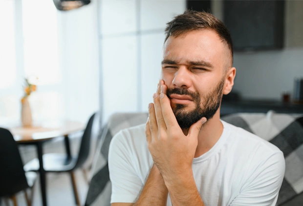Man feeling dental anxiety before emergency treatment at dental office