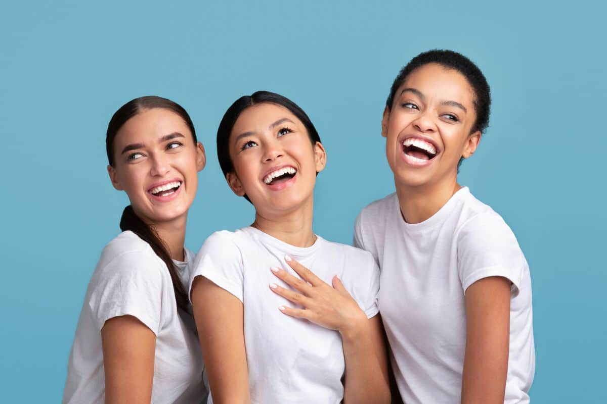 Family smiling after a dental checkup with their dentist dentist in sandy