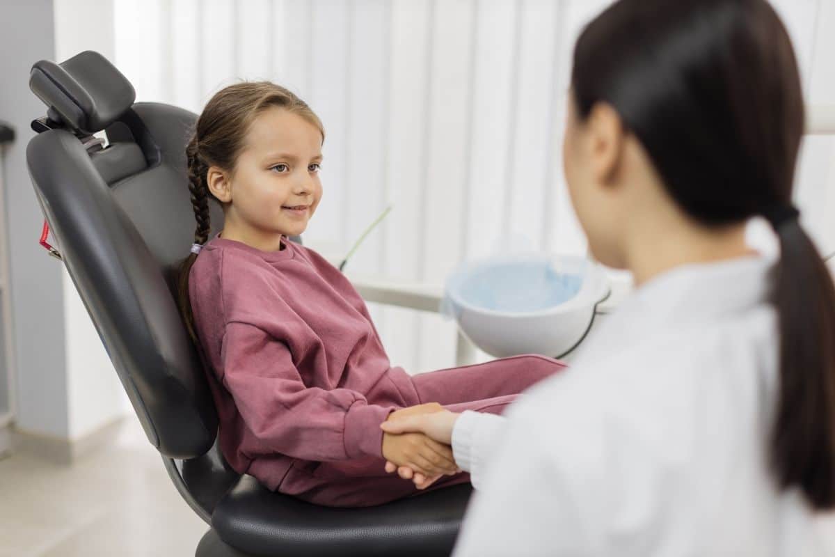 young-female-pediatric-dentist-shaking