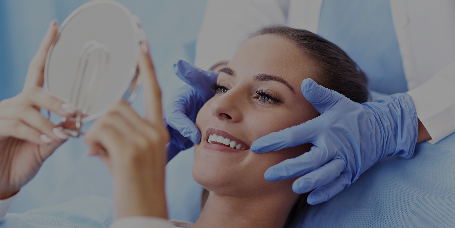 Dentist attending to a woman lying in a dental chair during a preventive dental care visit at Coastal Dental Arts in Peabody, MA