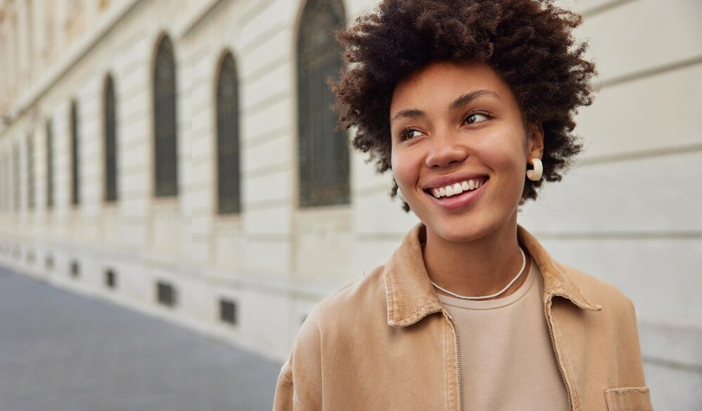 Woman smiling after dental crowns treatment at Coastal Dental Arts in Peabody, MA