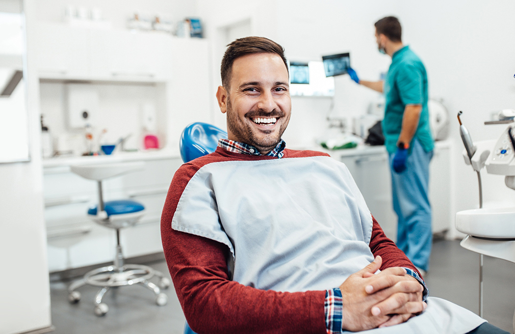 Gentleman smiling after oral surgery peabody at Coastal Dental Arts in Peabody, MA