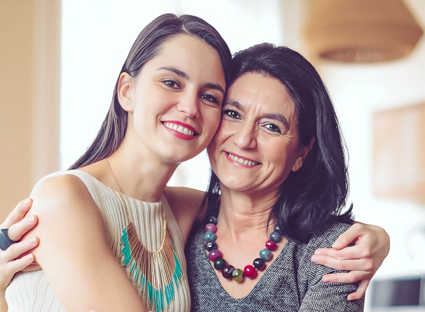 Woman with her young daughter visiting Coastal Dental Arts in Peabody, MA for restorative dental treatment