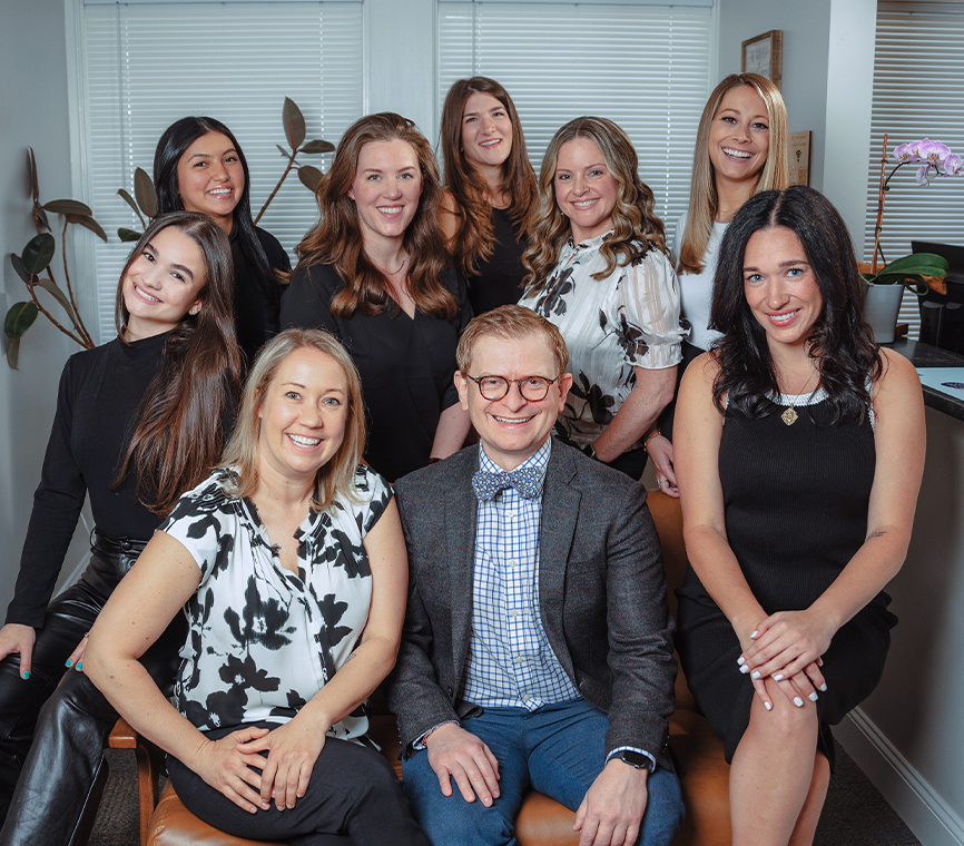Dr. Peter Brzoza, Dentist Peabody with full dental team group photo at Coastal Dental Arts