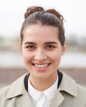 Smiling patient showing confidence with Invisalign clear aligner treatment