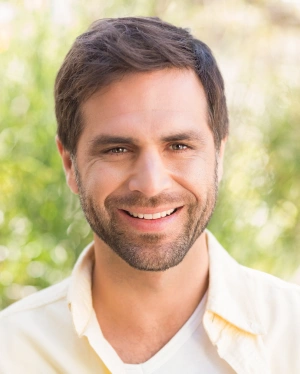 Smiling man with a healthy smile representing prompt emergency dental care
