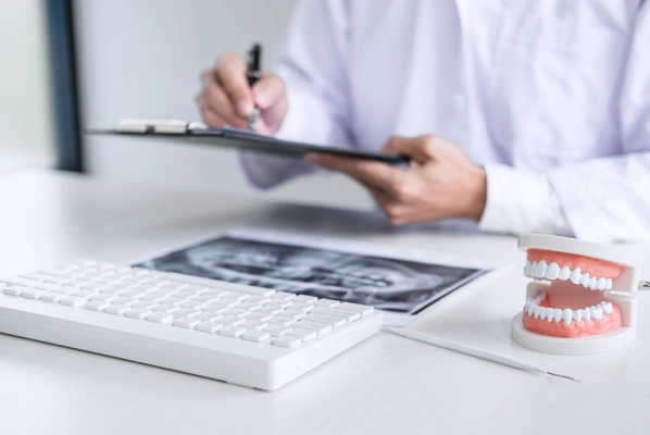 Dentist reviewing financial policy and payment options with a patient