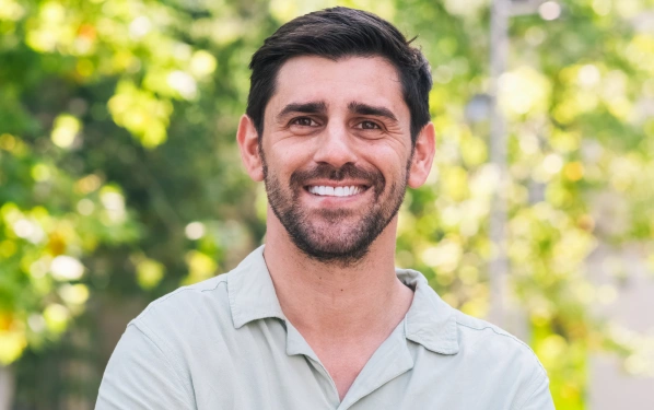 Patient smiling with a brighter smile after professional teeth whitening treatment