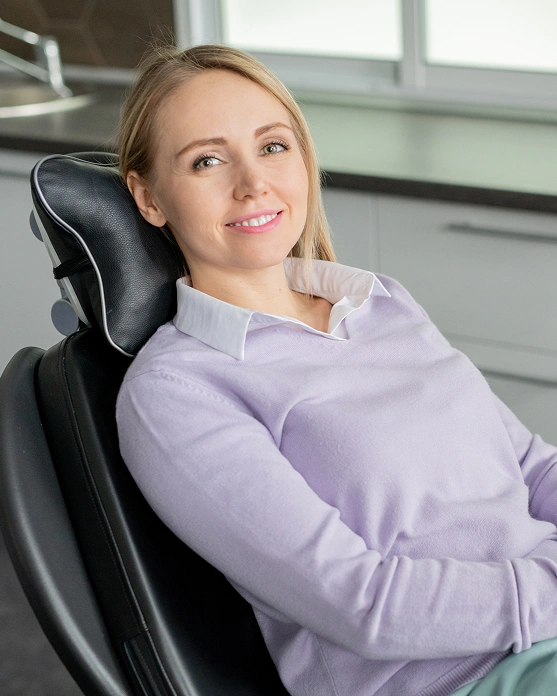 Female dental patient receiving comfortable emergency dental care