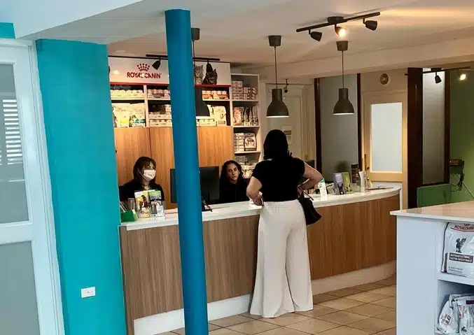 Client checking in at the reception desk