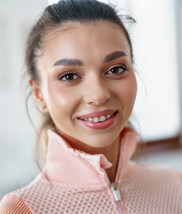 Portrait of a smiling patient during orthodontic treatment