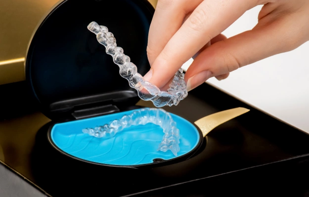 Clear aligner being placed onto a dental model