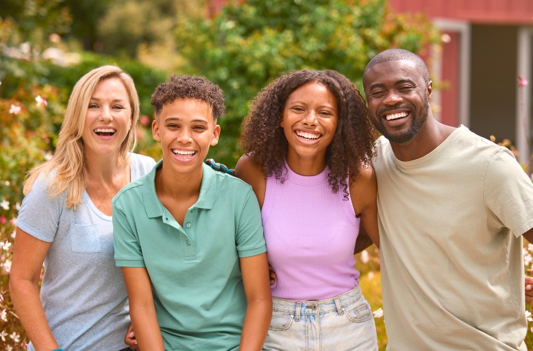 Smiling family in Austin with bright healthy smiles after dental cleaning at Daylight Dental