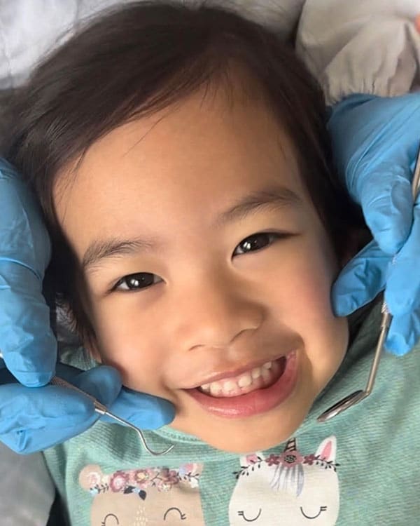 Child receiving gentle emergency dental care during a South Austin appointment with modern pediatric treatment support.