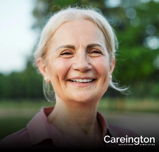 Portrait of a smiling older woman outdoors with a Careington dental plan logo overlay