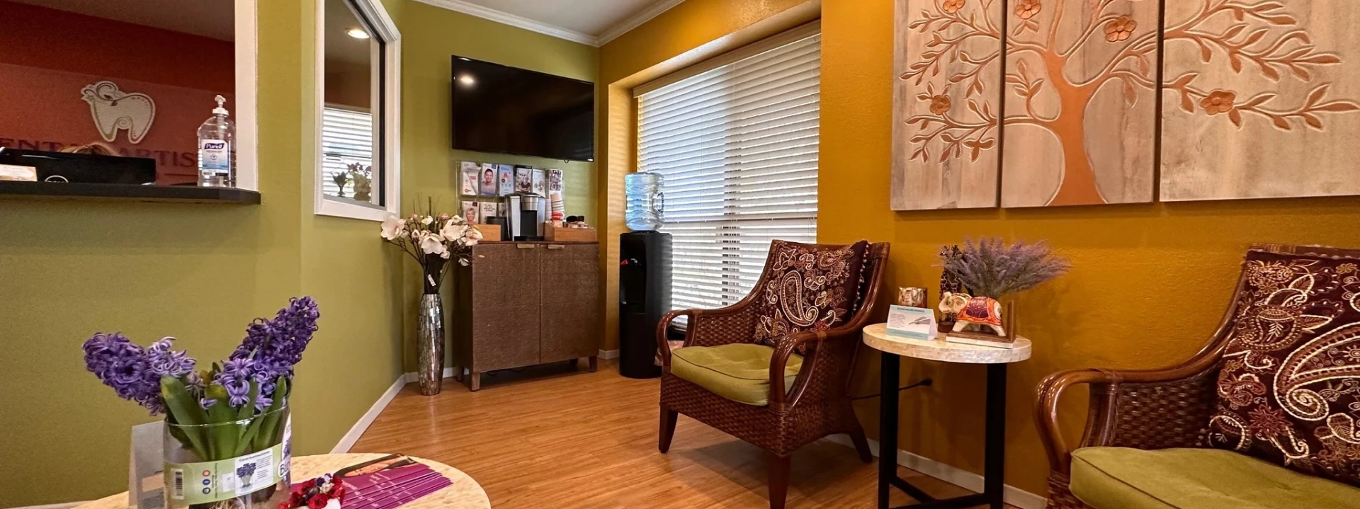 Dental Artistry Irving office waiting room with warm wood tones and decorative artwork