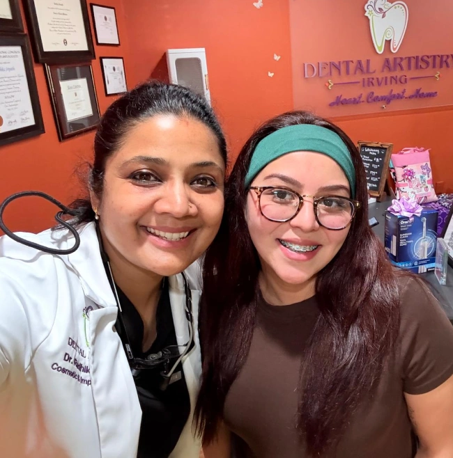 Dr. Radhika Srikrishnan Iyer posing with a smiling patient at Dental Artistry Irving