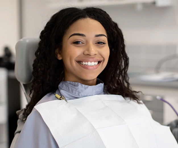 Happy patient smiling in the dental chair at The Dentist Place of Clearwater in Clearwater, FL