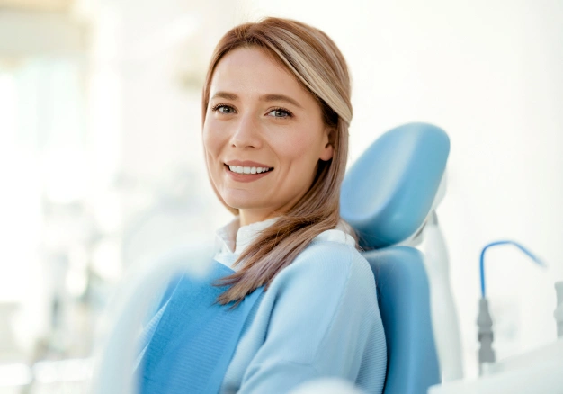Patient smiling confidently in the dental chair after gum contouring treatment at The Dentist Place of Clearwater in Clearwater, FL
