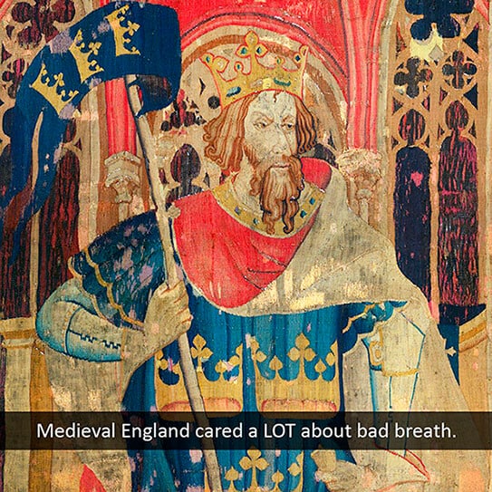 Medieval illuminated manuscript portrait of bearded man in royal garments and crown.