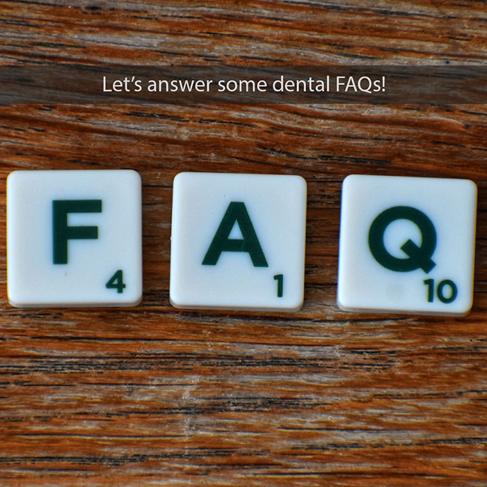 faq-2021_700.jpg Scrabble tiles spelling FAQ on wooden surface for dental frequently asked questions.