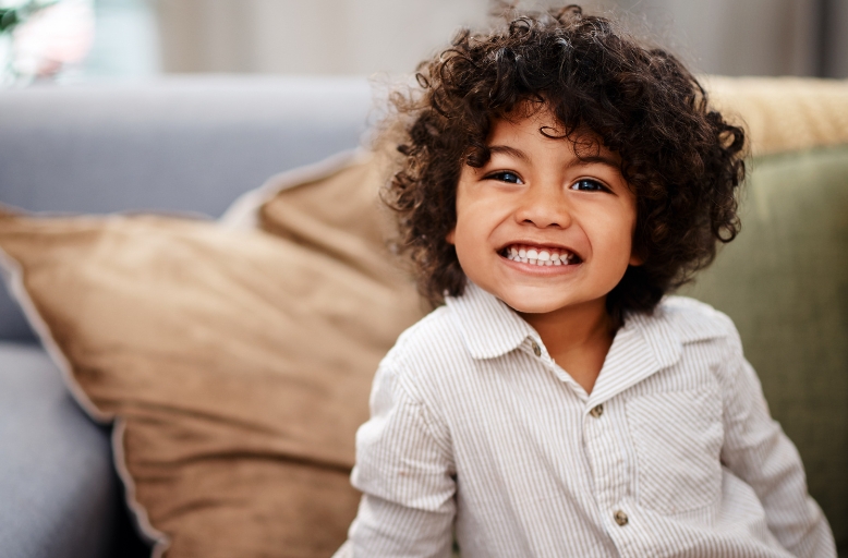 Smiling toddler representing healthy sleep while discussing toddler snoring and pediatric sleep apnea in Spokane Valley