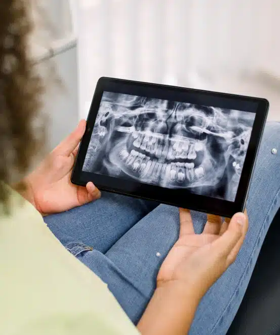 A patient checking her digital dental x-ray report