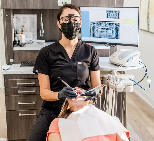 Tori, Horizon Dental Designs, Dental Hygienist ,Plant City, FL, working on a patient