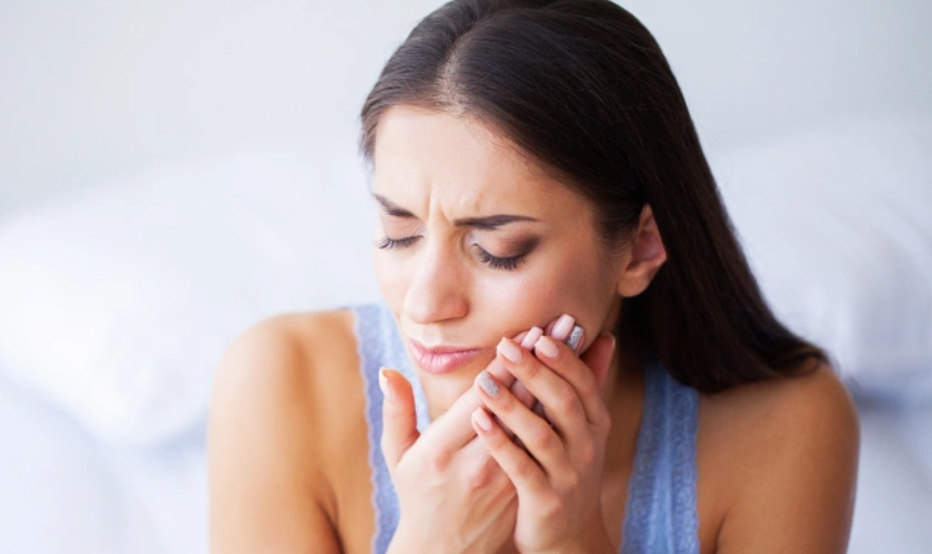 Emergency dentist in Fort Worth TX treating patient with severe tooth pain and dental infection