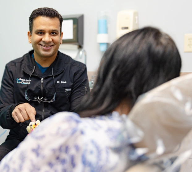Our Raleigh treating the patient for dental emergency services