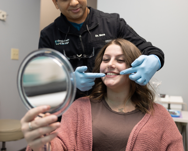 Raleigh Dentist performing professional teeth whitening on a patient