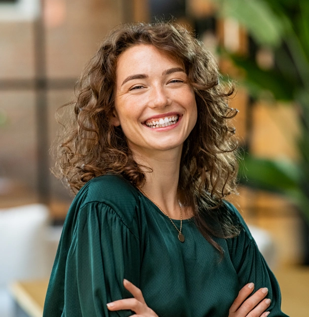 Woman with bright smile showcasing cosmetic dentistry results in Clewiston, FL.