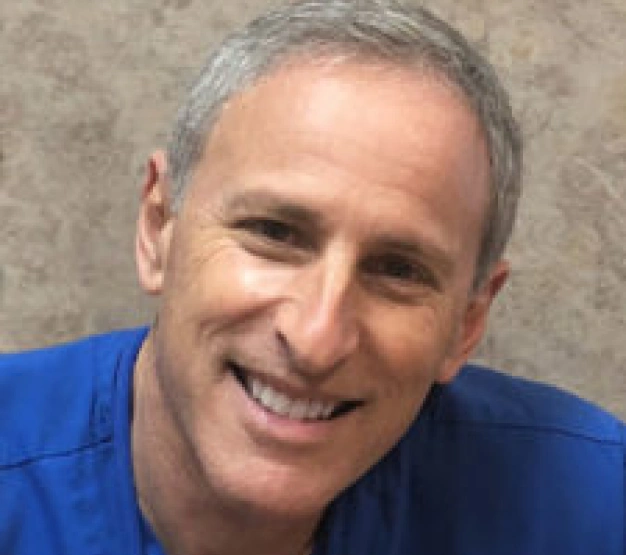 Dr. Clifford Yanover, dentist at Clewiston dental practice, smiling portrait.