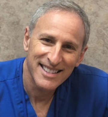 Dr. Clifford Yanover, dentist at Clewiston dental practice, smiling portrait.