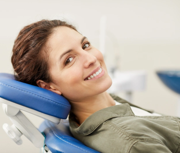 Smiling new patient relaxing in dental chair at Clewiston dental practice.