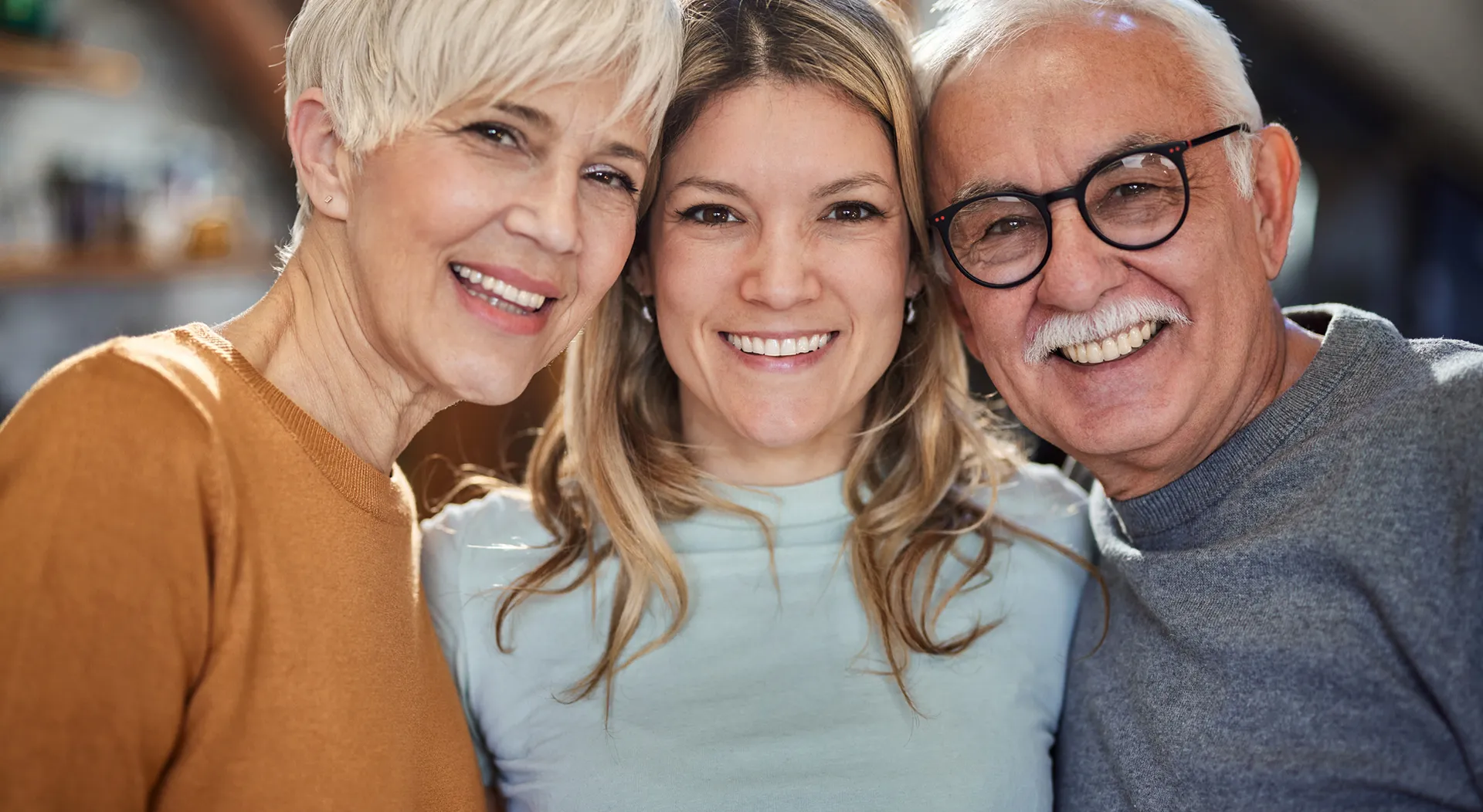 Happy family smiling together at dental practice in Clewiston, Florida.