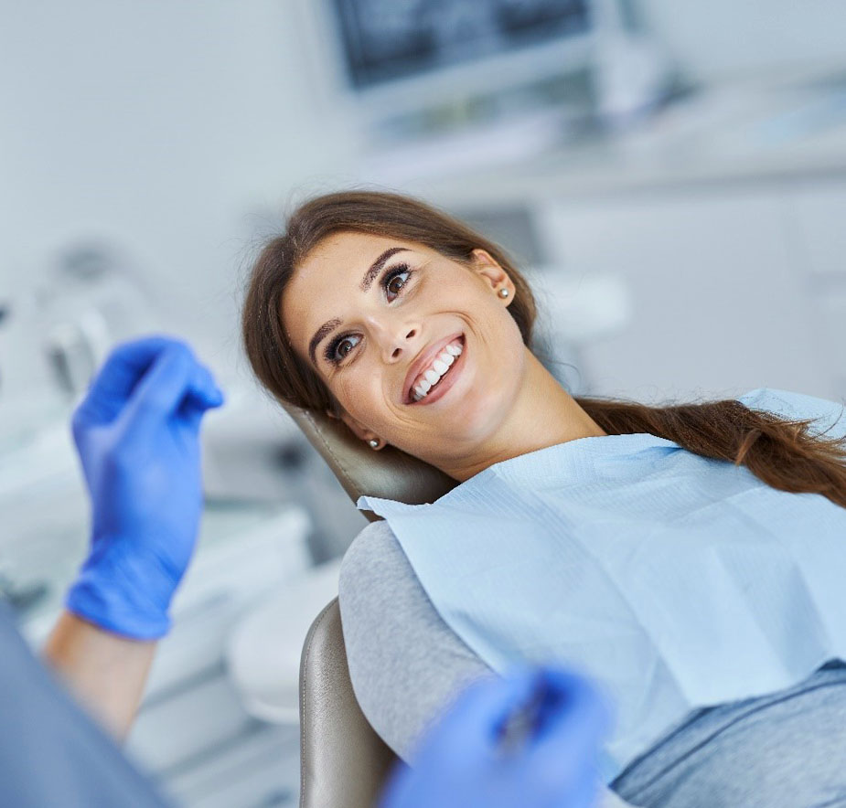 A woman undergoing a regular dental check-up at Hallmark Dental office.”